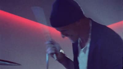 a man holding a knife and fork in his hand