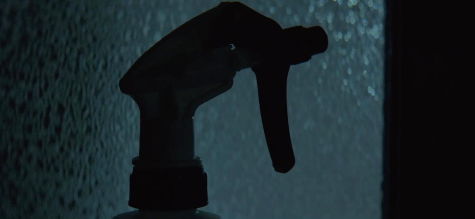 a close up of a spray bottle in the rain