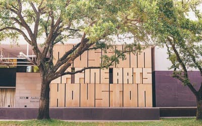 a building with a tree in front of it