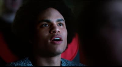 a close up of a person with a surprised look on his face