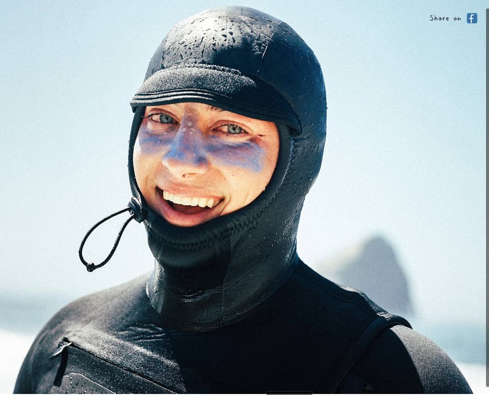 a man in a wet suit and a helmet