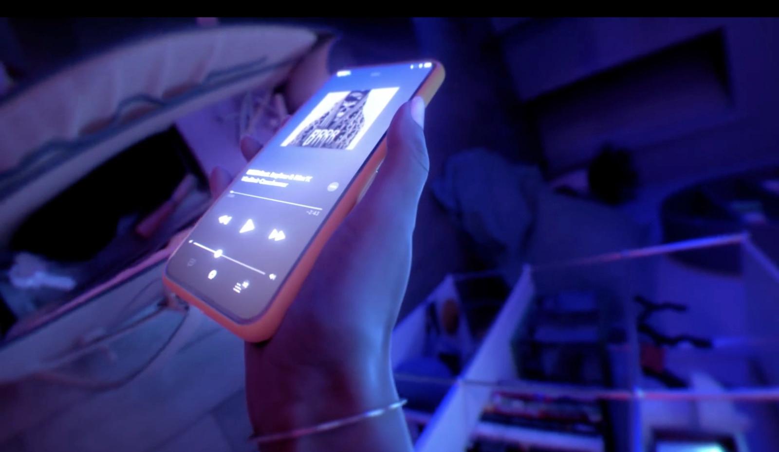 a person holding a cell phone in their hand