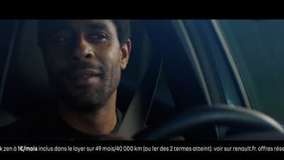 a man driving a car in the dark