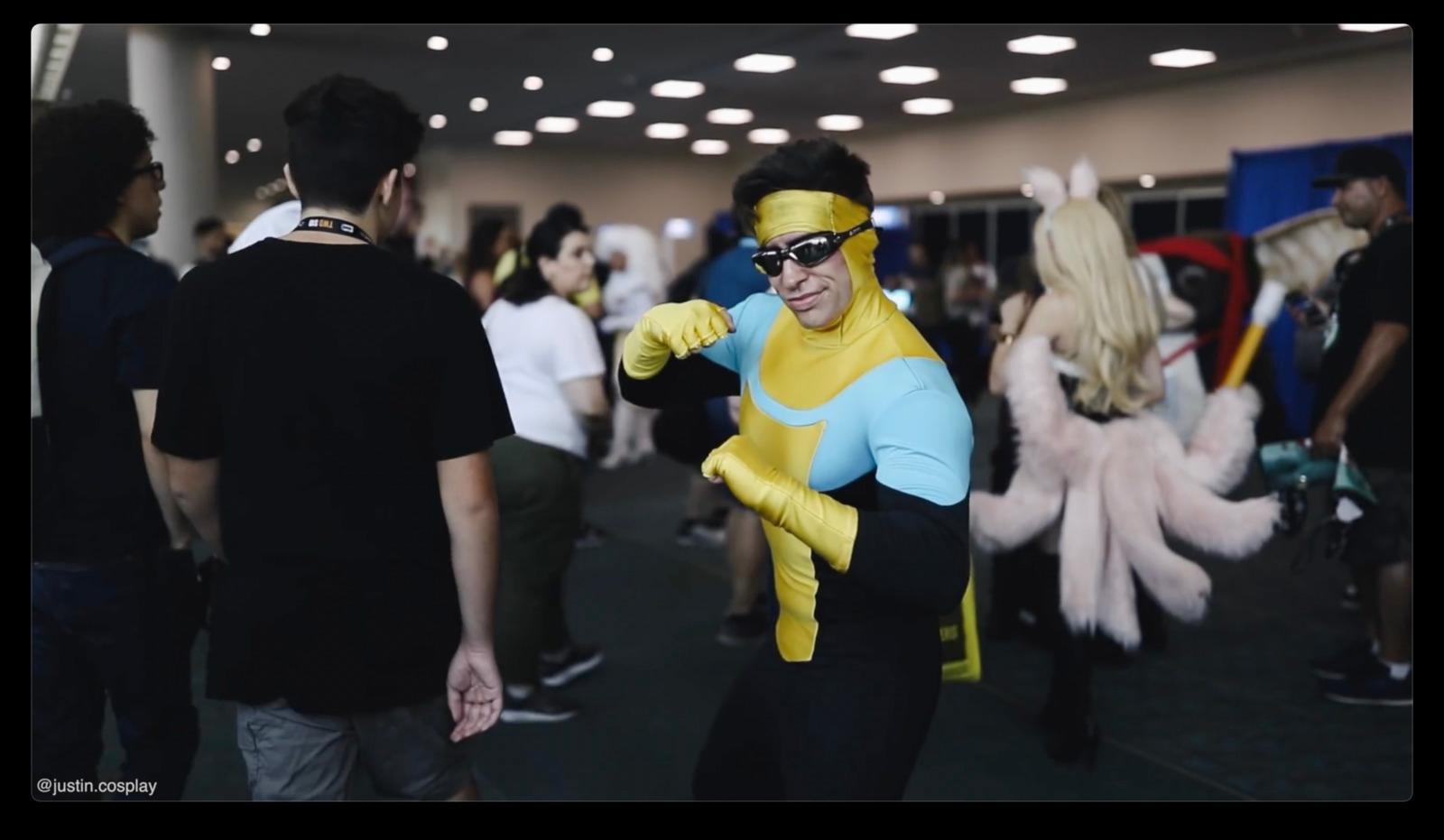 a man in a costume is dancing with other people
