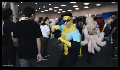 a man in a costume is dancing with other people