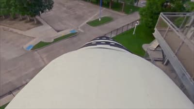 an aerial view of a skateboard park and a bench