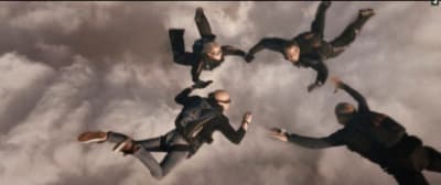 a group of people flying through the air