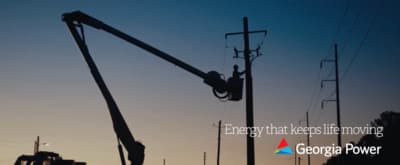 an electrician is working on a power pole
