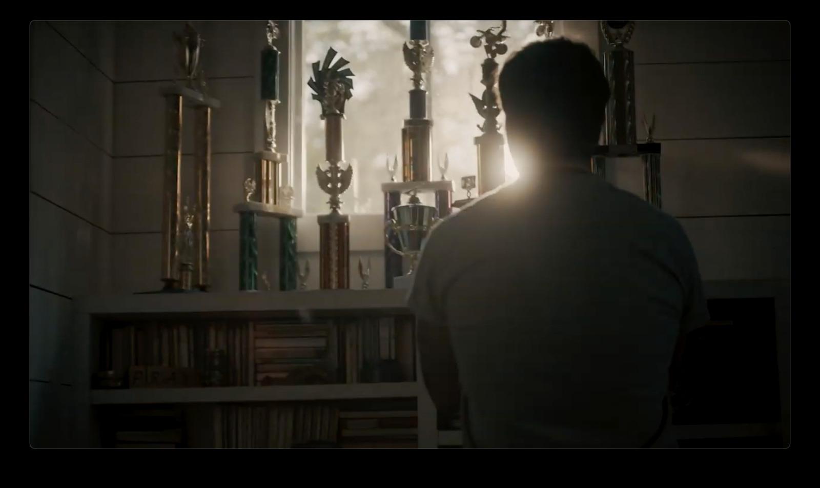 a man standing in front of a window in a room