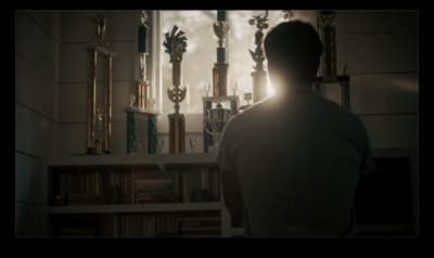 a man standing in front of a window in a room