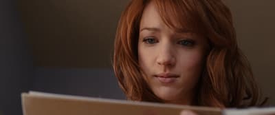 a close up of a person reading a book