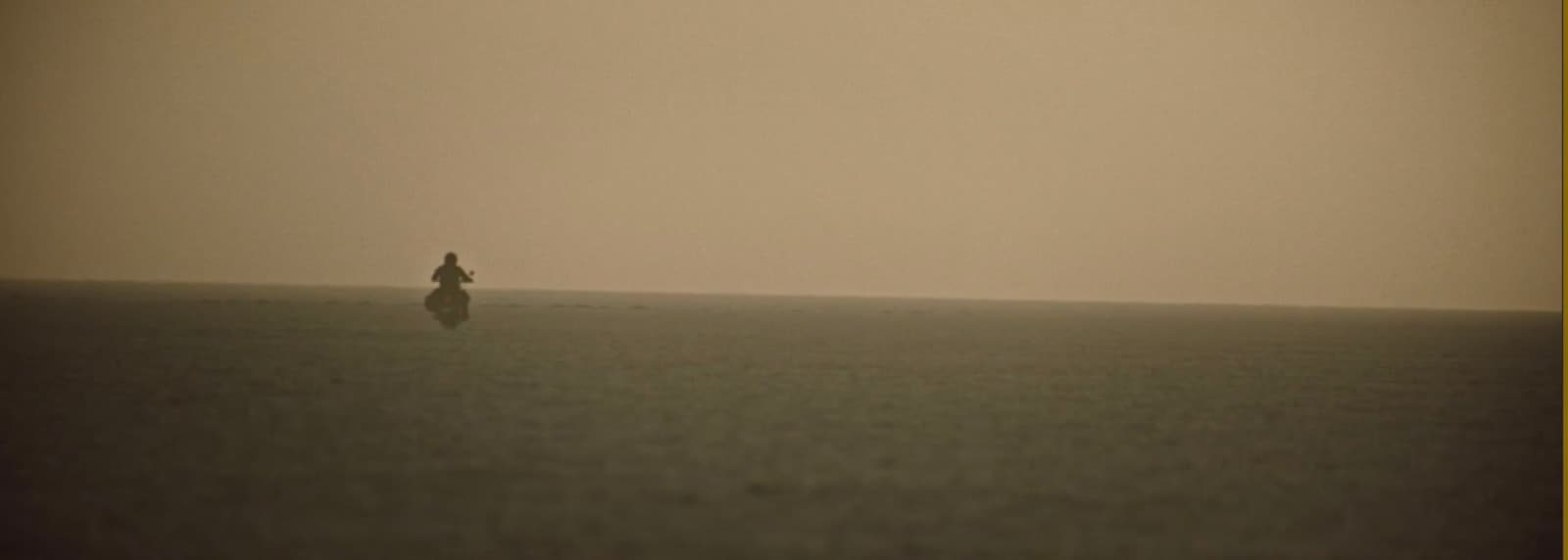 a person standing in the middle of a large body of water