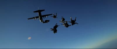 a group of people that are flying in the air