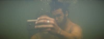 a man taking a picture of himself in a mirror