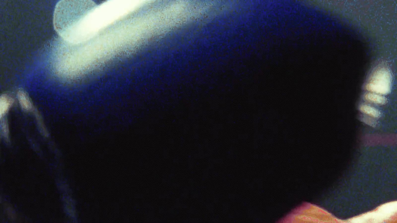 a blurry photo of a person holding a cell phone
