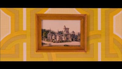 a picture of a castle in a frame on a wall