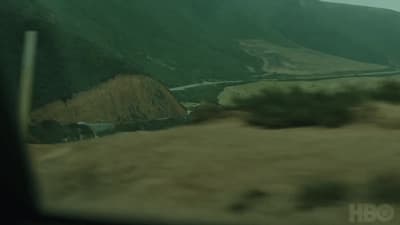 a view of a valley from a vehicle window