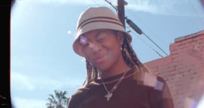 a person with a hat and a cell phone