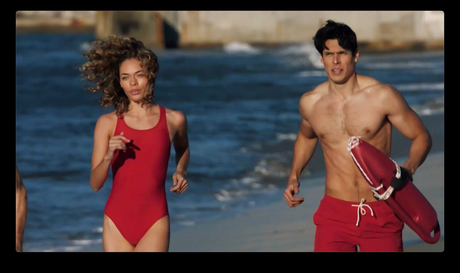 a man and a woman running on the beach