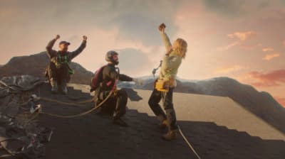 a group of people standing on top of a roof