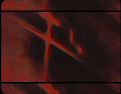 a picture of a cross on a red and black background