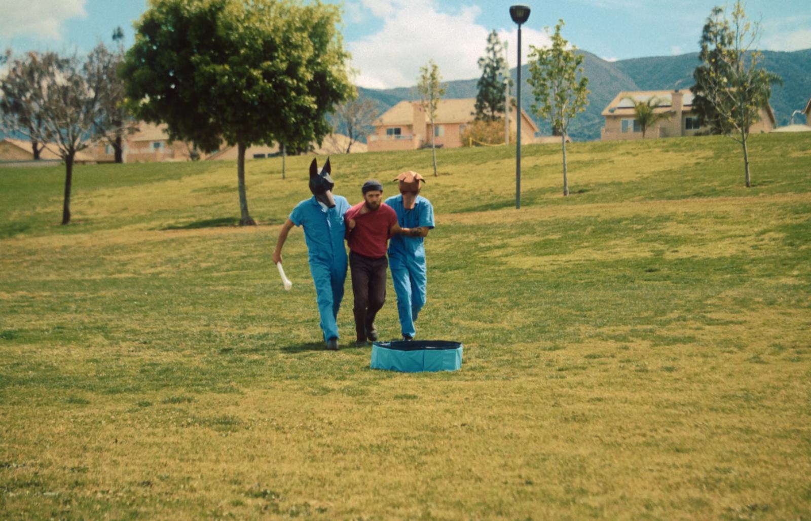 a group of people in animal costumes playing frisbee