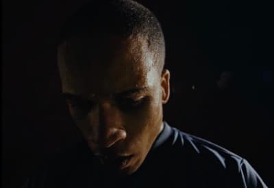a close up of a person wearing a black shirt