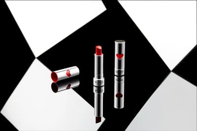 a couple of lipsticks sitting next to each other