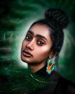 a woman with a pair of earrings on her ear