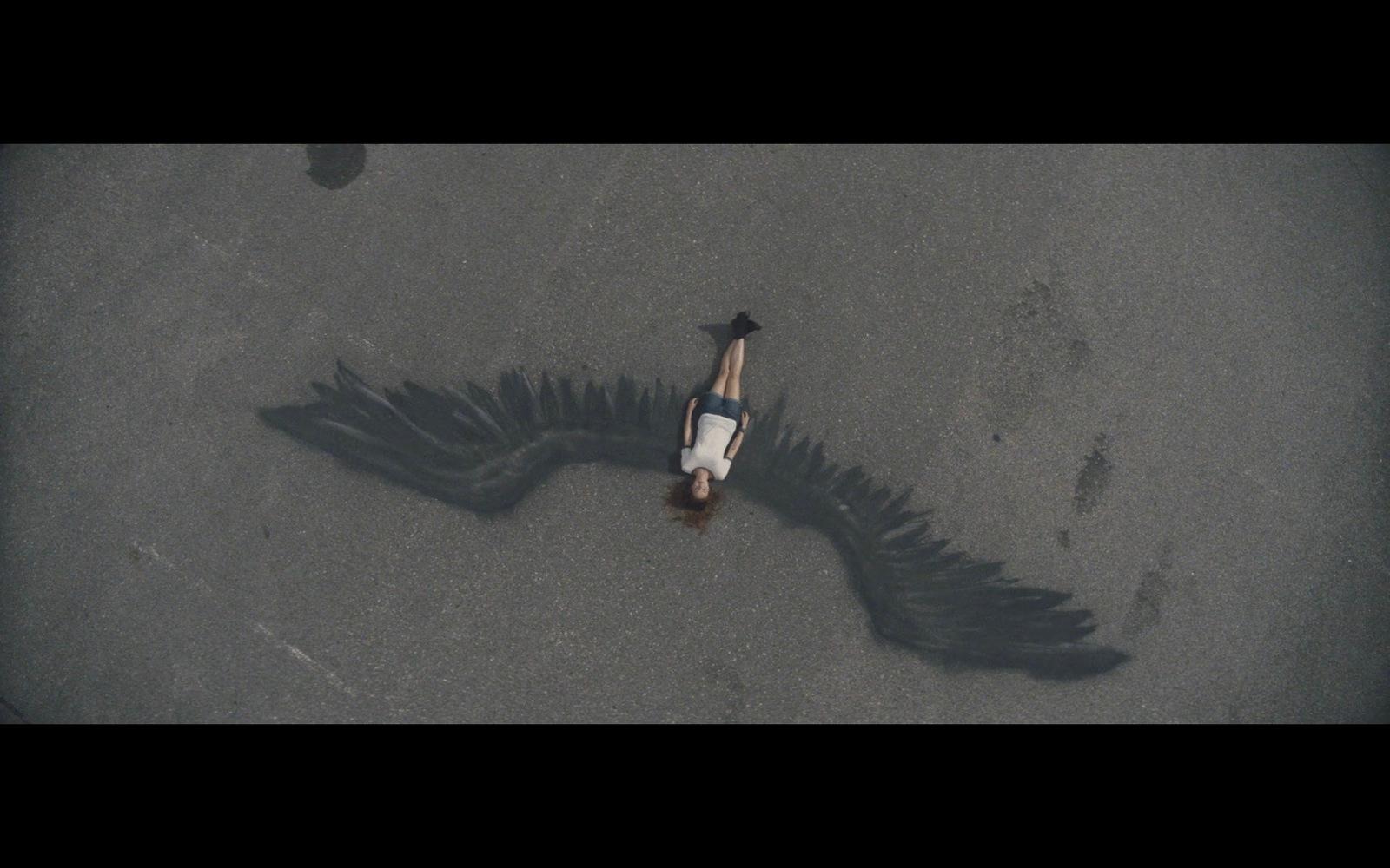 an aerial view of a person laying on the ground