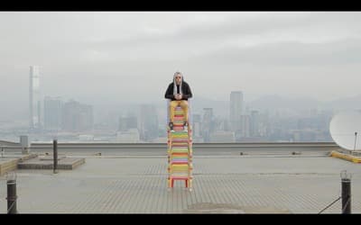 a man is standing on top of a building
