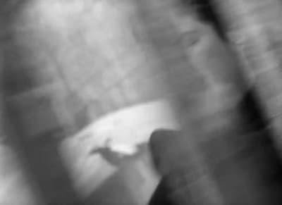 a blurry photo of a person holding a cell phone
