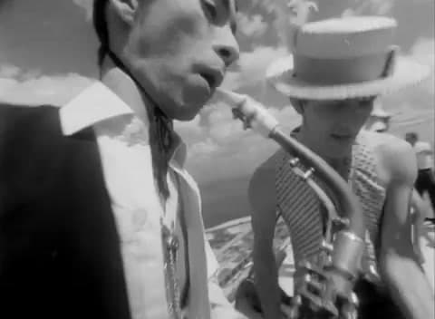 a man with a pipe in his mouth