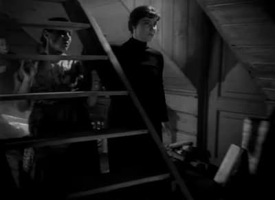 a man standing on top of a set of stairs
