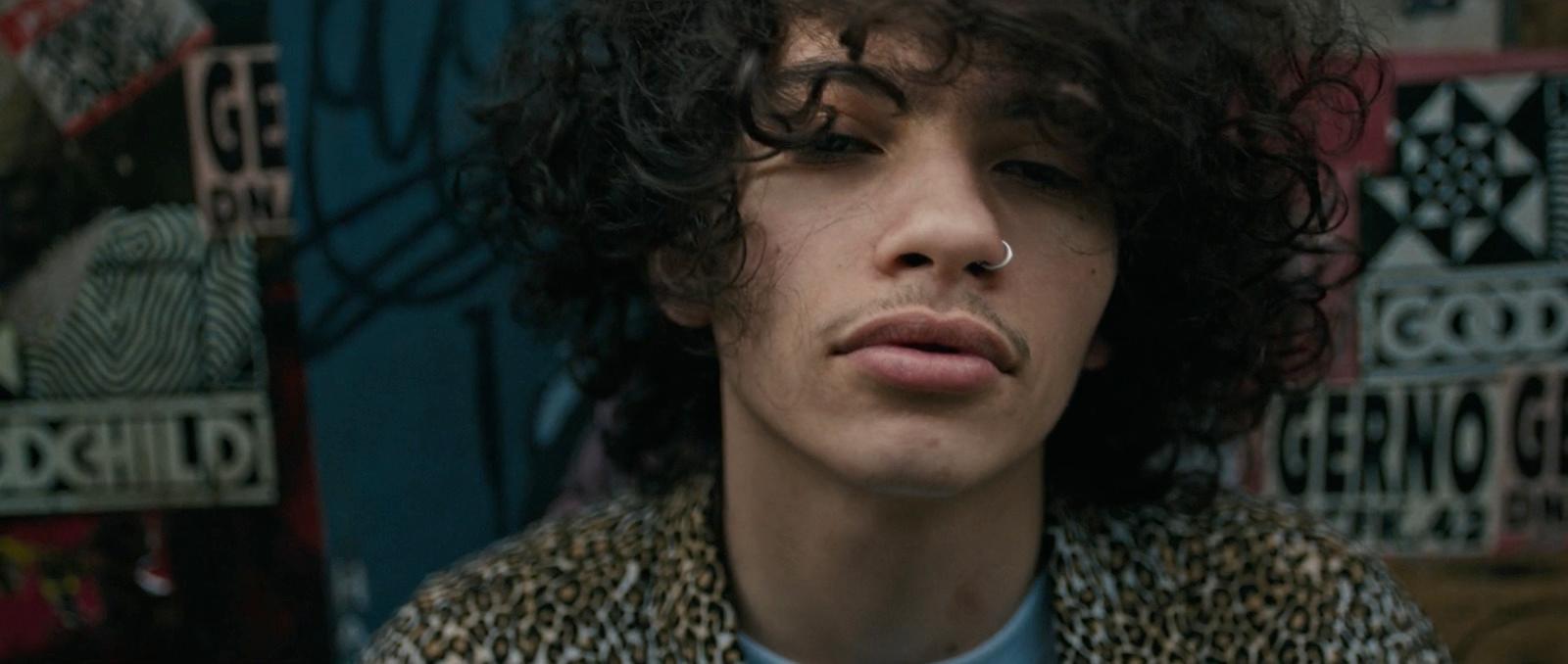 a close up of a person with curly hair