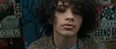 a close up of a person with curly hair