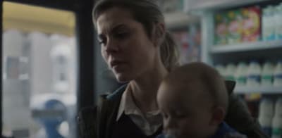 a woman holding a baby in her arms