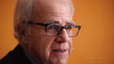 a close up of a person wearing glasses