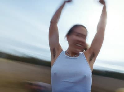 a blurry photo of a woman holding a frisbee