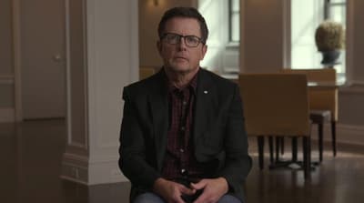 a man sitting on the floor in a room