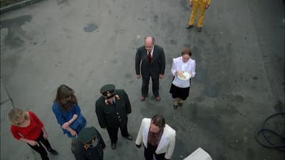 a group of people standing around each other