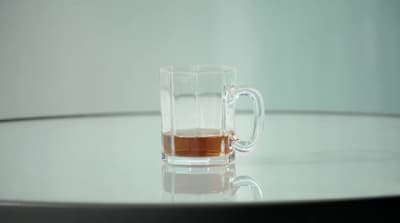 a glass of tea sits on a table