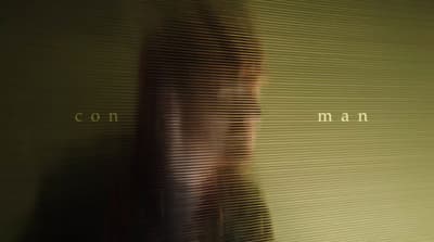 a blurry photo of a woman's face in front of a wall