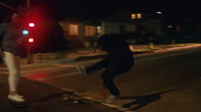 a person on a skateboard on a city street