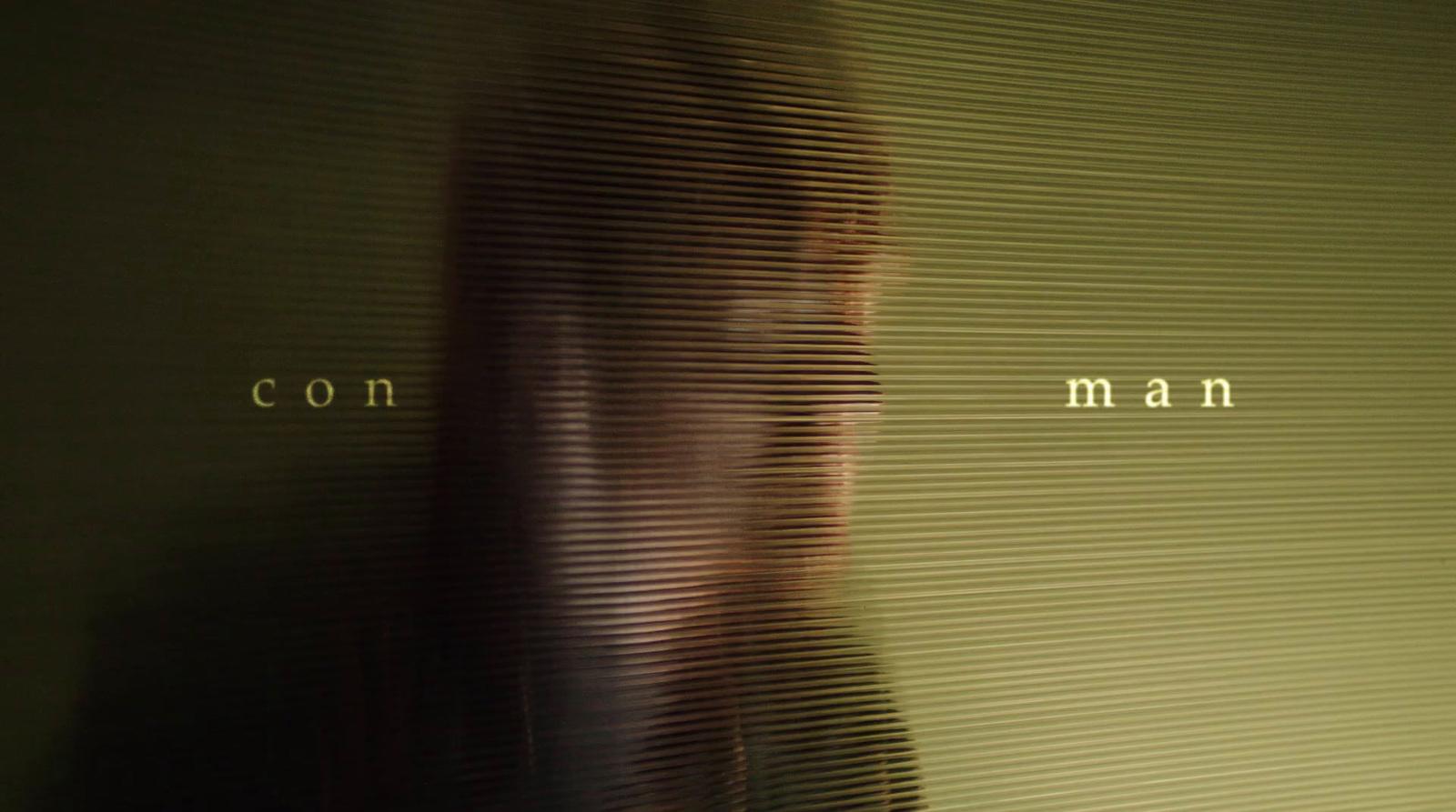 a blurry photo of a woman's face in front of a wall