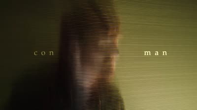 a blurry photo of a woman's face in front of a wall
