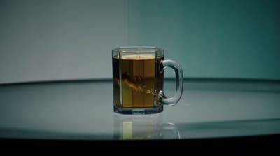 a cup of tea sitting on top of a table