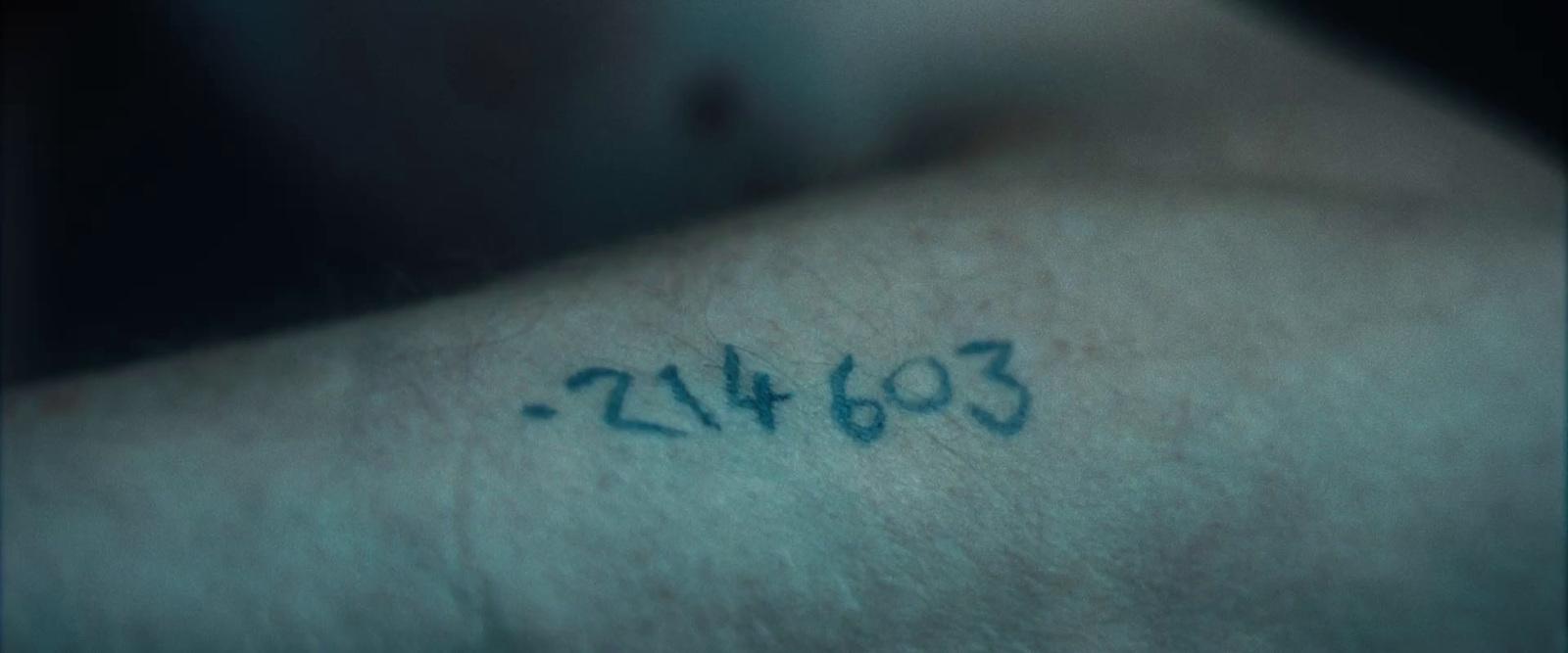 a close up of a person with a tattoo on his arm