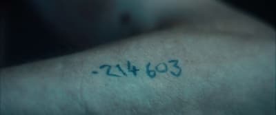 a close up of a person with a tattoo on his arm