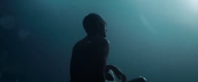a statue of a man standing in the dark